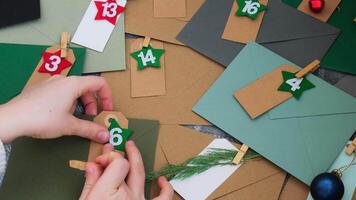 Step by step instruction of making handmade Christmas advent calendar with envelopes. Creative craft homemade decor. New year celebration. Winter holidays video