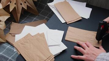 Master class of making craft paper snowflakes for conscientious Christmas decor. Sustainable celebration minimal responsible DIY holiday project. Step by step instruction video