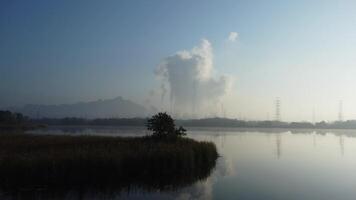 Aerial view of a coal-fired power plant with steam flowing out of the stack in the morning. Mae Moh. video