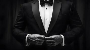 Elegant Man in Tuxedo Preparing for Formal Event in Black and White photo
