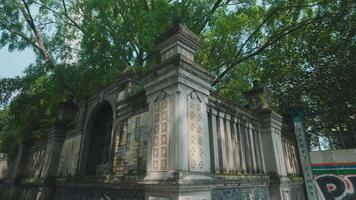 Historic Stone Structure Surrounded by Lush Greenery video