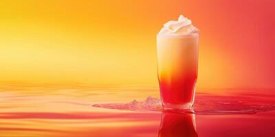 Glass of layered sunset colored drink photo