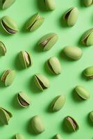 A seamless pattern of pistachios on green photo
