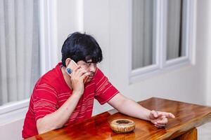 Man Having a Serious Phone Conversation. Intense Discussion Over a Phone Call. photo