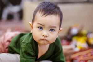 Adorable Baby Boy Looking at Camera. Cute Baby Boy with a Joyful Expression. photo