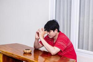 Man Considering Decisions While Sitting. Serene Moment of a Man in Deep Thought. photo