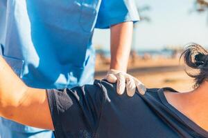 Close up of the hands of a A man is being helped by a nurse photo