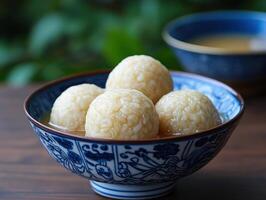 Delicious glutinous rice balls in sweet soup, symbolizing unity and joy photo