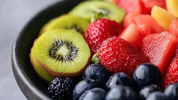 Fresh fruit platter with strawberries, kiwi, and blueberries, vibrant colors photo