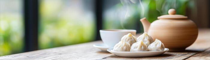 beautifully arranged table with dumplings and steaming tea photo