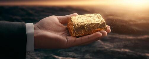 hand holding gold bar symbolizes wealth and prosperity photo