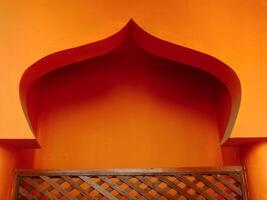 Islamic architectural background. Archway with an orange color and has a lot of detail. photo