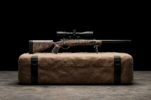 Close up of a hunting rifle on a textured surface photo