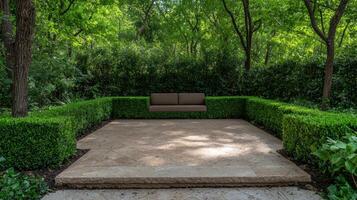 Secluded patio with a brown couch and lush green hedges photo