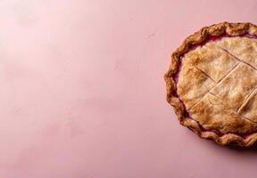 Top view of a delicious berry pie on a pink background photo