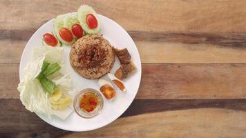 rice with fried mackerel boil egg shrimp paste chili sauce and vetgetable and fish fry original thai food photo