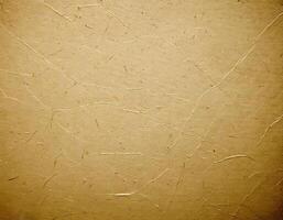 Textured beige paper background with visible fibers and subtle creases, perfect for design projects needing a natural and organic photo