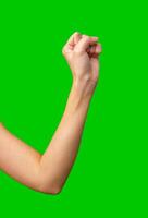 Fist raised in solidarity against a vibrant green backdrop during a social movement awareness campaign photo