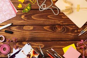 Crafting fun at a creative workspace with colorful materials on a wooden table photo