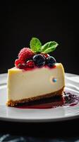 A piece of cheesecake with berries and mint photo
