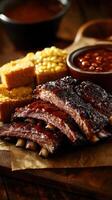 Barbecue Ribs with Corn and Salsa Sauce on Wooden Background photo