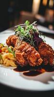 Crispy fried chicken fillet with french fries and vegetable salad photo