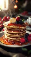 Pancakes with berries and maple syrup on wooden table, closeup photo