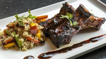 Beef ribs with couscous and vegetables on a white plate photo