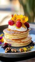 Pancakes with raspberries, honey and whipped cream. photo