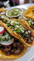 Mexican beef tacos with guacamole and fresh radish photo