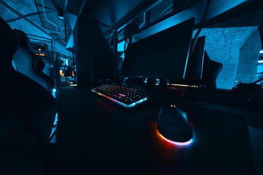 Gaming setup with illuminated keyboard and mouse in a dark environment photo