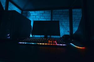Excluded gaming computer with neon keyboard. photo