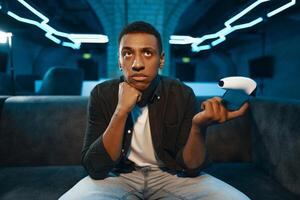 A player who is waiting for the start of the game in the game console. Pause in the game. photo