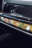 Close-up view of modern car interior features highlighting design elements and craftsmanship with intricate details photo