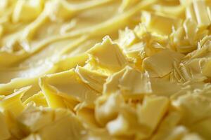 Cocoa butter is creating a textured yellow background photo