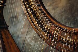 Closeup of harp strings and tuning pegs in warm light photo
