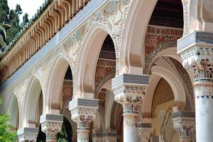 Ornate moorish arches creating stunning patterns in courtyard photo