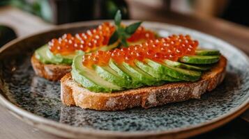 Gourmet avocado toast with salmon roe on rustic bread for breakfast delight photo