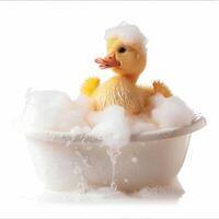 Cute yellow duckling taking a relaxing bubble bath photo