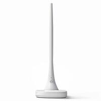 Modern white led desk lamp standing on white background photo