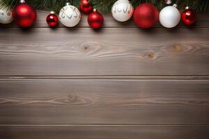 Christmas ornaments hanging on a rustic wooden background with copy space photo