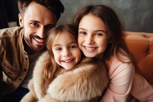 Happy family smiling and embracing on sofa at home photo