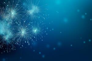 Fireworks exploding in the dark blue night sky creating a festive atmosphere photo