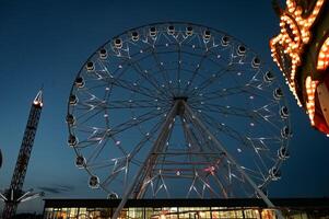 amusement park On a beautiful day with ferris wheel photo
