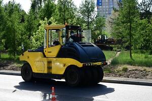 Large view on the road rollers working on the new road construction site On a wonderful day with a positive attitude photo