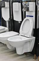 On a wonderful day with a positive attitudeToilet bowls in a home goods store photo