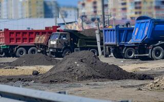 excavator is working and digging at construction site On a wonderful day with a positive attitude photo