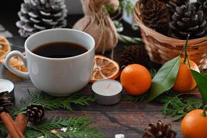 The image showcases the intricate details of a holiday coffee setting, with small white marshmallows, delicate evergreen sprigs, and twinkling fairy lights photo