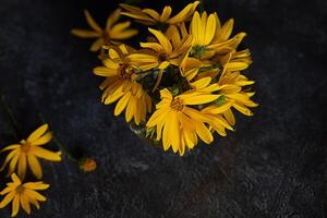 A picture of a blank card and envelope surrounded by yellow flowers photo