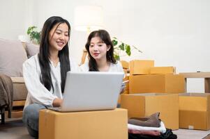 Female online business owners are working in the living room, checking orders on a laptop. photo